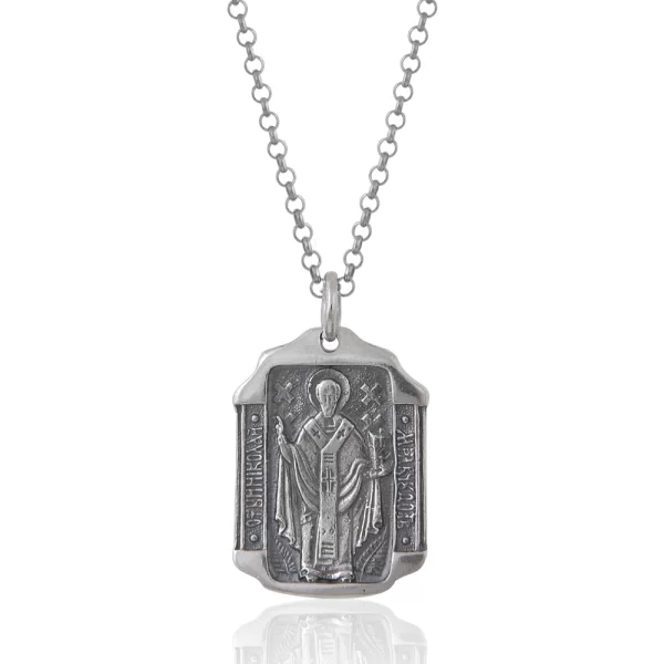 Ασημένιο μενταγιόν με φλουρί με δύο όψεις σε πολυγωνικό σχήμα με απεικονιζόμενο τον Άγιο Νικόλαο